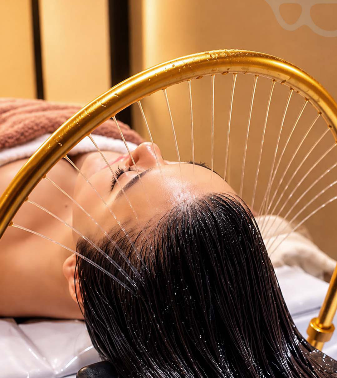 Client relaxing during the Solmaic Luxurious Korean Hair Spa