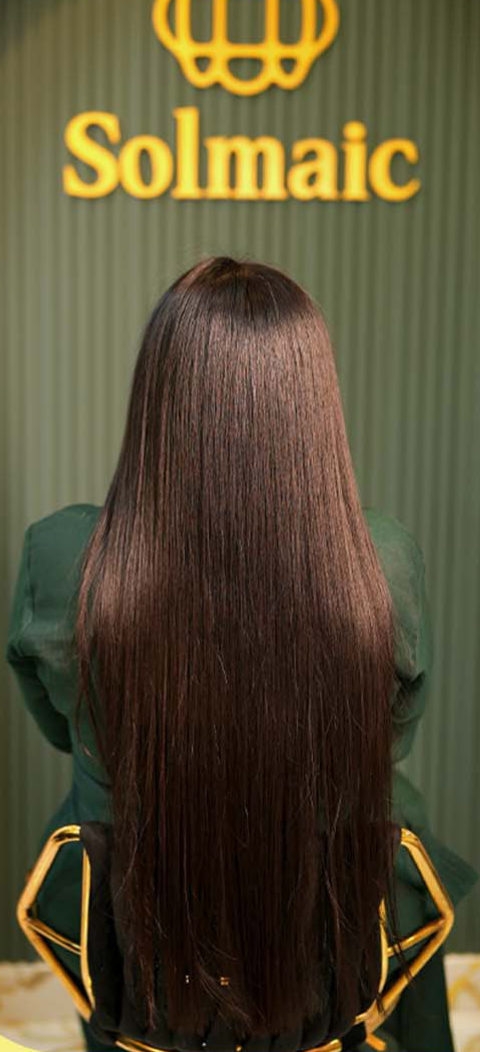 Long, smooth, glossy hair after treatment at Solmaic